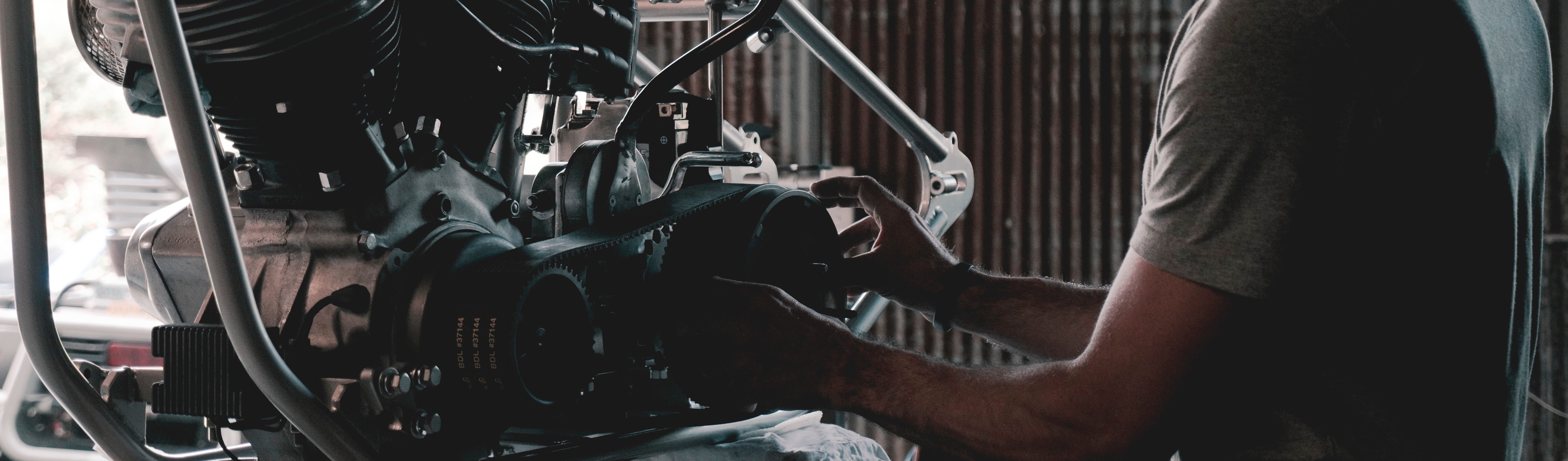 Car Mechanic Checking Transmission - GWCars.org